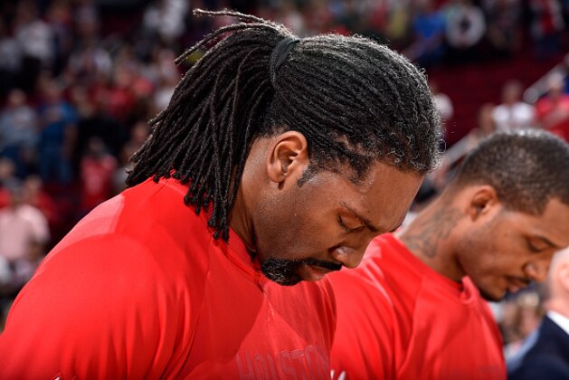 HOUSTON, TX - MARCH 28: Nene Hilario #42 of the Houston Rockets stands for a moment of silence for the National Anthem before the game against the Golden State Warriors on March 28, 2017 at the Toyota Center in Houston, Texas. NOTE TO USER: User expressly acknowledges and agrees that, by downloading and or using this photograph, User is consenting to the terms and conditions of the Getty Images License Agreement. Mandatory Copyright Notice: Copyright 2017 NBAE (Photo by Bill Baptist/NBAE via Getty Images)