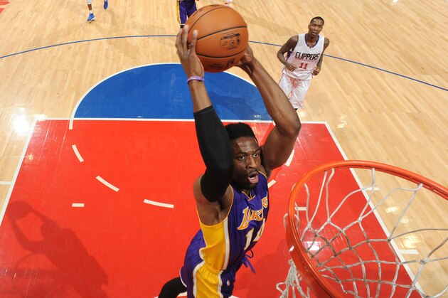 LOS ANGELES, CA - APRIL 1: David Nwaba #10 of the Los Angeles Lakers dunks against the LA Clippers during the game on April 1, 2017 at STAPLES Center in Los Angeles, California. NOTE TO USER: User expressly acknowledges and agrees that, by downloading and/or using this Photograph, user is consenting to the terms and conditions of the Getty Images License Agreement. Mandatory Copyright Notice: Copyright 2017 NBAE (Photo by Andrew D. Bernstein/NBAE via Getty Images)
