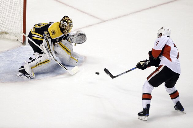Ottawa Senators center Kyle Turris (7) scores against Boston Bruins goalie Tuukka Rask (40) in the shootout of an NHL hockey game, Thursday, April 6, 2017, in Boston. The Senators won 2-1. (AP Photo/Elise Amendola)