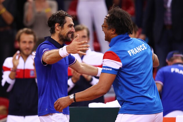 ROUEN, FRANCE - APRIL 07:  (L-R) Jeremy Chardy of France celebrates with Yannick Noah the France captain following his victory during the singles match against Daniel Evans of Great Britain on day one of the Davis Cup World Group Quarter-Final between France and Great Britain at Kindarena on April 7, 2017 in Rouen, France.  (Photo by Clive Brunskill/Getty Images)