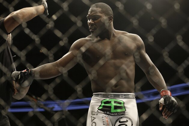 Anthony Johnson is pushed away by referee Herb Dean after beating Antonio Rogerio Nogueira by technical knockout during a light heavyweight mixed martial arts bout at a UFC on Fox event in San Jose, Calif., Saturday, July 26, 2014. Johnson won by technical knockout. (AP Photo/Jeff Chiu)