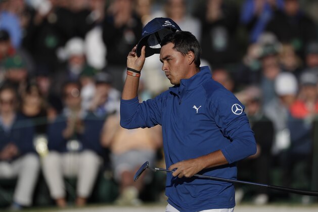 Rickie Fowler tips his hat on the 18th green during the second round of the Masters golf tournament Friday, April 7, 2017, in Augusta, Ga. (AP Photo/Matt Slocum)