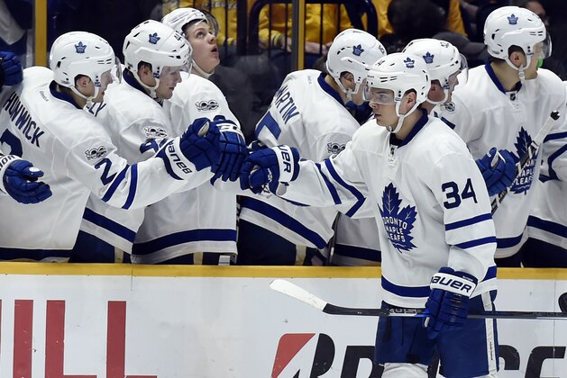 Toronto Maple Leafs center Auston Matthews (34) is congratulated after scoring a goal against the Nashville Predators during the second period of an NHL hockey game Thursday, March 30, 2017, in Nashville, Tenn. (AP Photo/Mark Zaleski)