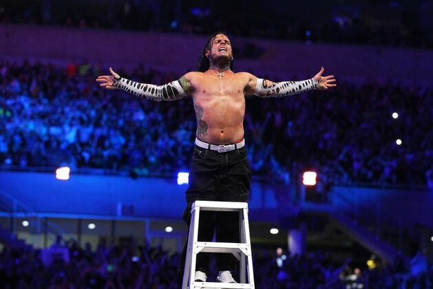 Jeff Hardy about to jump off a ladder at WrestleMania 33.