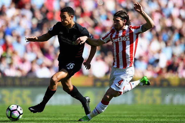 STOKE ON TRENT, ENGLAND - APRIL 08: Trent Alex Arnold of Liverpool (L) and Joe Allen of Stoke City (R) battle for possession during the Premier League match between Stoke City and Liverpool at Bet365 Stadium on April 8, 2017 in Stoke on Trent, England.  (Photo by Gareth Copley/Getty Images)
