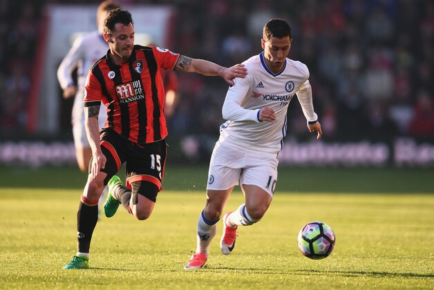 BOURNEMOUTH, ENGLAND - APRIL 08: Adam Smith of AFC Bournemouth (L) and Eden Hazard of Chelsea (R) battle for possession during the Premier League match between AFC Bournemouth and Chelsea at Vitality Stadium on April 8, 2017 in Bournemouth, England.  (Photo by Mike Hewitt/Getty Images)