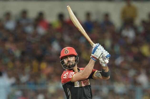Royal Challengers Bangalore captain Virat Kohli plays a shot during the 2016 Indian Premier League (IPL) Twenty20 cricket match between Kolkata Knight Riders and Royal Challengers Bangalore at the Eden Gardens Cricket Stadium in Kolkata on May 16, 2016.  ----IMAGE RESTRICTED TO EDITORIAL USE - STRICTLY NO COMMERCIAL USE----- / GETTYOUT' / AFP / Dibyangshu SARKAR        (Photo credit should read DIBYANGSHU SARKAR/AFP/Getty Images)