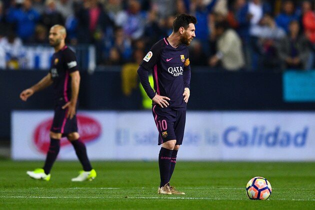 MALAGA, SPAIN - APRIL 08:  Lionel Messi of FC Barcelona reacts dejected after Sandro Ramirez of Malaga CF scored the opening goal during the La Liga match between Malaga CF and FC Barcelona at La Rosaleda stadium on April 8, 2017 in Malaga, Spain.  (Photo by David Ramos/Getty Images)