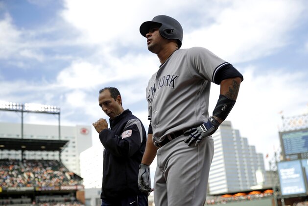 New York Yankees' Gary Sanchez walks off the field after injuring himself during an at-bat in the fifth inning of a baseball game against the Baltimore Orioles in Baltimore, Saturday, April 8, 2017. (AP Photo/Patrick Semansky)