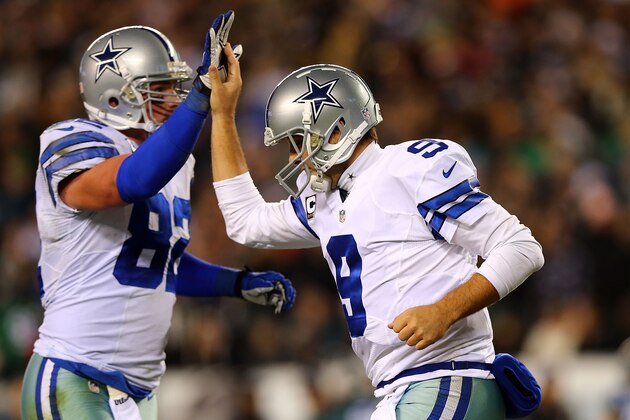 PHILADELPHIA, PA - DECEMBER 14:  Tony Romo #9 of the Dallas Cowboys high fives Jason Witten #82 after a touchdown in the first quarter against the Philadelphia Eagles at Lincoln Financial Field on December 14, 2014 in Philadelphia, Pennsylvania.  (Photo by Elsa/Getty Images)