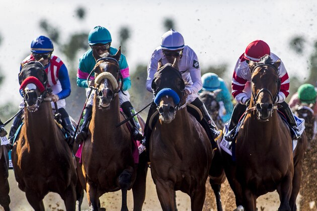 ARCADIA, CA - APRIL 08: The field battle for position as they approach the finish line of the Santa Anita Derby at Santa Anita Park on April 8, 2017 in Arcadia, California. Gormley (teal), ridden by Victor Espinoza, won the race. (Photo by Alex Evers/Eclipse Sportswire/Getty Images)