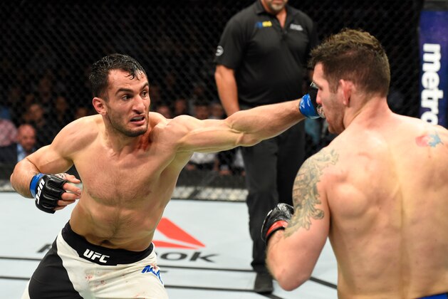 BUFFALO, NY - APRIL 08:  Gegard Mousasi of the Netherlands (L) lands a punch on Chris Weidman in their middleweight bout during the UFC 210 event at KeyBank Center on April 8, 2017 in Buffalo, New York.  (Photo by Josh Hedges/Zuffa LLC/Zuffa LLC via Getty Images)