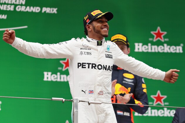 SHANGHAI, CHINA - APRIL 09: Lewis Hamilton of Great Britain and Mercedes GP celebrates his win on the podium during the Formula One Grand Prix of China at Shanghai International Circuit on April 9, 2017 in Shanghai, China.  (Photo by Mark Thompson/Getty Images)