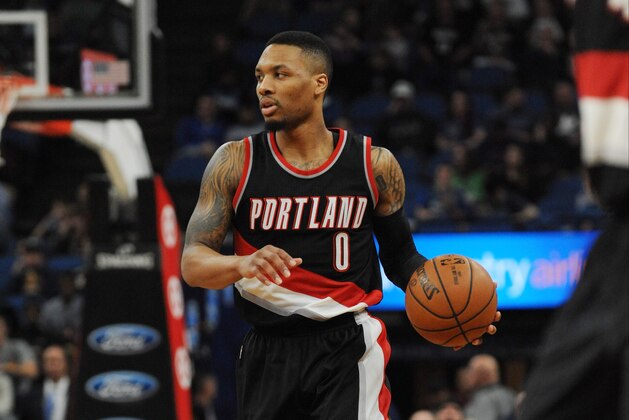 Apr 3, 2017; Minneapolis, MN, USA; Portland Trail Blazers guard Damian Lillard (0) dribbles the ball in the second half against the Minnesota Timberwolves at Target Center. The Wolves won 110-109. Mandatory Credit: Marilyn Indahl-USA TODAY Sports