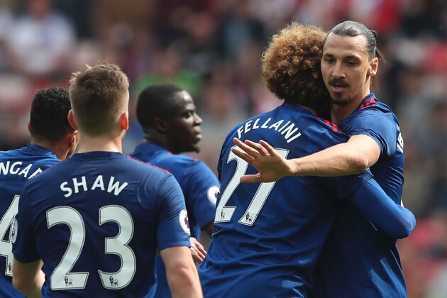 Manchester United's Swedish striker Zlatan Ibrahimovic (R) celebrates scoring the opening goal during the English Premier League football match between Sunderland and Manchester United at the Stadium of Light in Sunderland, north-east England on April 9, 2017. / AFP PHOTO / Scott Heppell / RESTRICTED TO EDITORIAL USE. No use with unauthorized audio, video, data, fixture lists, club/league logos or 'live' services. Online in-match use limited to 75 images, no video emulation. No use in betting, games or single club/league/player publications.  /         (Photo credit should read SCOTT HEPPELL/AFP/Getty Images)