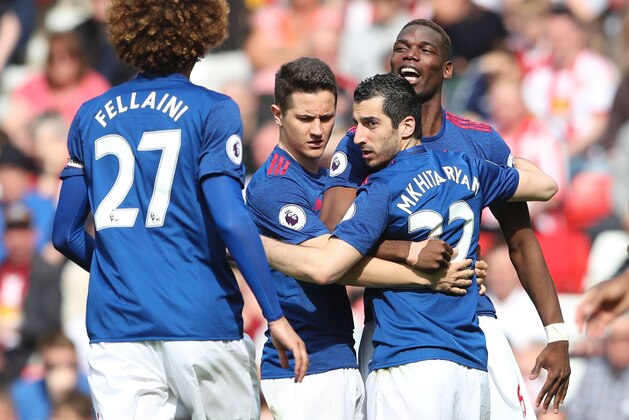 Manchester United's Armenian midfielder Henrikh Mkhitaryan (2R) celebrates scoring their second goal with Manchester United's French midfielder Paul Pogba (R) and Manchester United's Spanish midfielder Ander Herrera (2L) during the English Premier League football match between Sunderland and Manchester United at the Stadium of Light in Sunderland, north-east England on April 9, 2017. / AFP PHOTO / Scott Heppell / RESTRICTED TO EDITORIAL USE. No use with unauthorized audio, video, data, fixture lists, club/league logos or 'live' services. Online in-match use limited to 75 images, no video emulation. No use in betting, games or single club/league/player publications.  /         (Photo credit should read SCOTT HEPPELL/AFP/Getty Images)