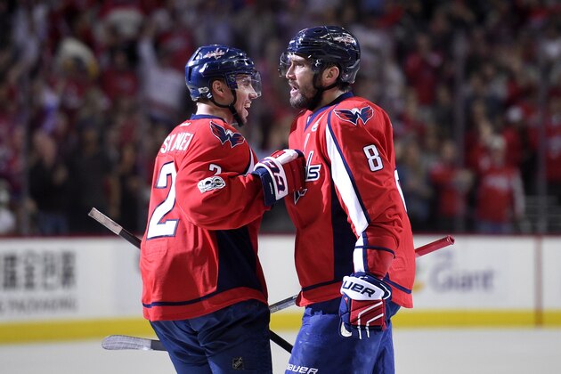 UPDATES SCORER OF GOAL, AFTER CHANGE IN SCORING - Washington Capitals left wing Alex Ovechkin (8), of Russia, celebrates a Capitals goal by Justin Williams with defenseman Matt Niskanen (2) during the second period of an NHL hockey game against the New York Rangers, Wednesday, April 5, 2017, in Washington. Ovechkin had an assist on the goal.  (AP Photo/Nick Wass)