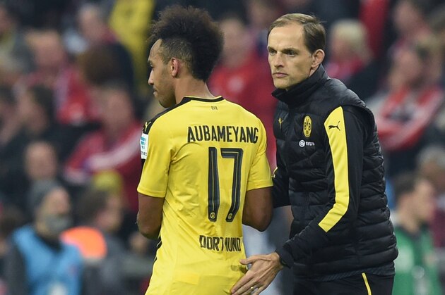 Dortmund's head coach Thomas Tuchel (R) thanks Dortmund's Gabonese forward Pierre-Emerick Aubameyang after the German first division Bundesliga football match FC Bayern Munich v BVB Borussia Dortmund in Munich, southern Germany, on April 8, 2017. / AFP PHOTO / Christof STACHE / RESTRICTIONS: DURING MATCH TIME: DFL RULES TO LIMIT THE ONLINE USAGE TO 15 PICTURES PER MATCH AND FORBID IMAGE SEQUENCES TO SIMULATE VIDEO. == RESTRICTED TO EDITORIAL USE == FOR FURTHER QUERIES PLEASE CONTACT DFL DIRECTLY AT + 49 69 650050
        (Photo credit should read CHRISTOF STACHE/AFP/Getty Images)