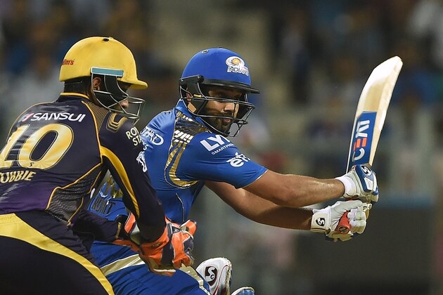Mumbai Indians captain Rohit Sharma (R) plays a shot during the 2016 Indian Premier League (IPL) Twenty20 cricket match between Mumbai Indians and Kolkata Knight Riders at The Wankhede Cricket Stadium in Mumbai on April 28, 2016.ï¿½ï¿½ï¿½ï¿½ / AFP / PUNIT PARANJPE / ----IMAGE RESTRICTED TO EDITORIAL USE - STRICTLY NO COMMERCIAL USE----- / GETTYOUT        (Photo credit should read PUNIT PARANJPE/AFP/Getty Images)