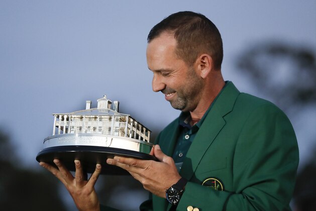 Sergio Garcia, of Spain, kisses his trophy at the green jacket ceremony after the Masters golf tournament Sunday, April 9, 2017, in Augusta, Ga. (AP Photo/David Goldman)