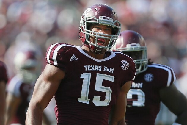 COLLEGE STATION, TX - SEPTEMBER 03: Myles Garrett #15 of the Texas A&M Aggies reacts after a defensive play against the UCLA Bruins on September 3, 2016 in College Station, Texas. (Photo by Bob Levey/Getty Images)