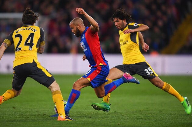 LONDON, ENGLAND - APRIL 10:  Andros Townsend of Crystal Palace takes on Mohamed Elneny and Hector Bellerin of Arsenal during the Premier League match between Crystal Palace and Arsenal at Selhurst Park on April 10, 2017 in London, England.  (Photo by Mike Hewitt/Getty Images)