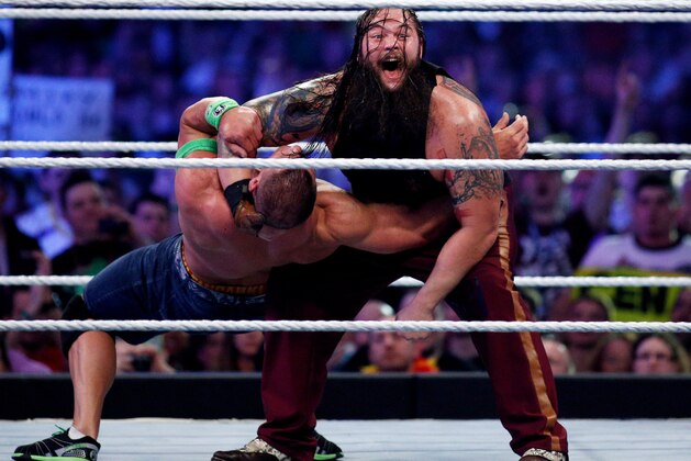 John Cena, left, and Bray Wyatt, right, compete during Wrestlemania XXX at the Mercedes-Benz Super Dome in New Orleans on Sunday, April 6, 2014. (Jonathan Bachman/AP Images for WWE)