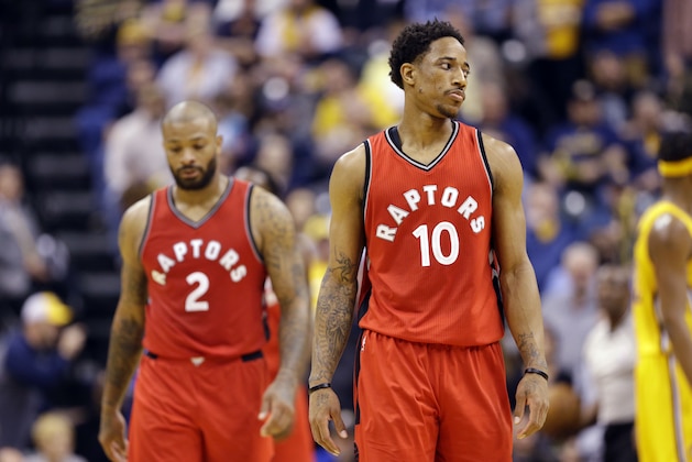 Toronto Raptors guard DeMar DeRozan (10) and forward PJ Tucker (2) return to the bench during the second half of the team's NBA basketball game against the Indiana Pacers in Indianapolis, Tuesday, April 4, 2017. The Pacers defeated the Raptors 108-90. (AP Photo/Michael Conroy)