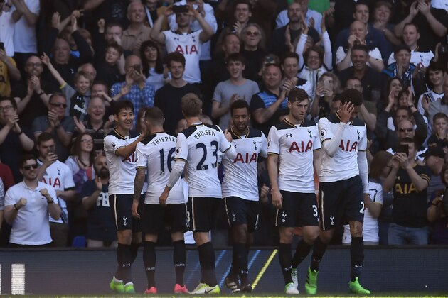 Tottenham Hotspur's South Korean striker Son Heung-Min (L) celebrates scoring his team's third goal during the English Premier League football match between Tottenham Hotspur and Watford at White Hart Lane in London, on April 8, 2017. / AFP PHOTO / Justin TALLIS / RESTRICTED TO EDITORIAL USE. No use with unauthorized audio, video, data, fixture lists, club/league logos or 'live' services. Online in-match use limited to 75 images, no video emulation. No use in betting, games or single club/league/player publications.  /         (Photo credit should read JUSTIN TALLIS/AFP/Getty Images)