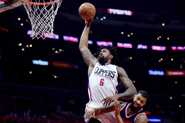 LOS ANGELES, CA - MARCH 29:  DeAndre Jordan #6 of the LA Clippers dunks over Markieff Morris #5 of the Washington Wizards during a 133-124 Clipper win at Staples Center on March 29, 2017 in Los Angeles, California.  NOTE TO USER: User expressly acknowledges and agrees that, by downloading and or using this photograph, User is consenting to the terms and conditions of the Getty Images License Agreement.  (Photo by Harry How/Getty Images)