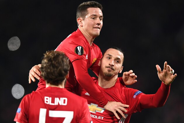 MANCHESTER, ENGLAND - FEBRUARY 16:  Zlatan Ibrahimovic of Manchester United celebrates scoring his sides first goal with Ander Herrera  during the UEFA Europa  League Round of 32 first leg match between Manchester United and AS Saint-Etienne at Old Trafford on February 16, 2017 in Manchester, United Kingdom.  (Photo by Shaun Botterill/Getty Images)