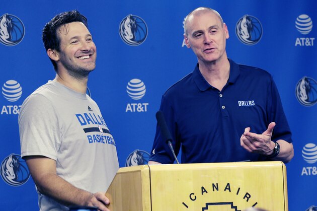 Former Dallas Cowboys quarterback Tony Romo, left, and Dallas Mavericks head coach Rick Carlisle share a laugh while speaking to reporters  in Dallas, Tuesday, April 11, 2017. Romo will be a Maverick for day and ride the bench when the team plays a home finale featuring two teams that failed to make the playoffs this year. (AP Photo/LM Otero)
