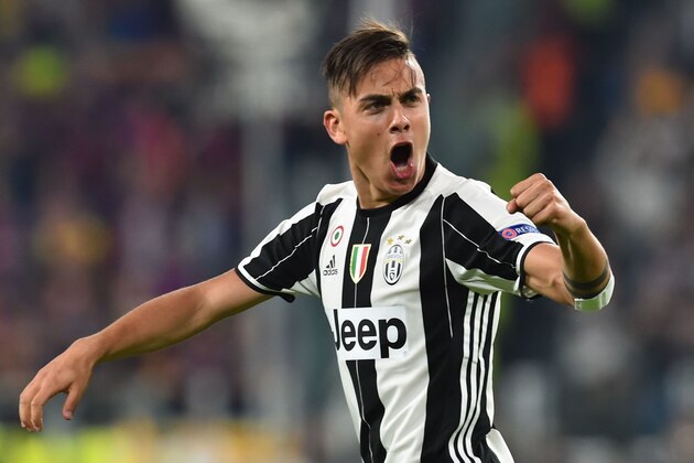 Juventus' forward from Argentina Paulo Dybala celebrates after scoring during the UEFA Champions League quarter final first leg football match Juventus vs Barcelona, on April 11, 2017 at the Juventus stadium in Turin.  / AFP PHOTO / GIUSEPPE CACACE        (Photo credit should read GIUSEPPE CACACE/AFP/Getty Images)