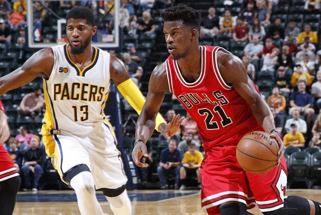 INDIANAPOLIS, IN - OCTOBER 06: Jimmy Butler #21 of the Chicago Bulls drives against Paul George #13 of the Indiana Pacers during a preseason game at Bankers Life Fieldhouse on October 6, 2016 in Indianapolis, Indiana. The Pacers defeated the Bulls 115-108. (Photo by Joe Robbins/Getty Images)