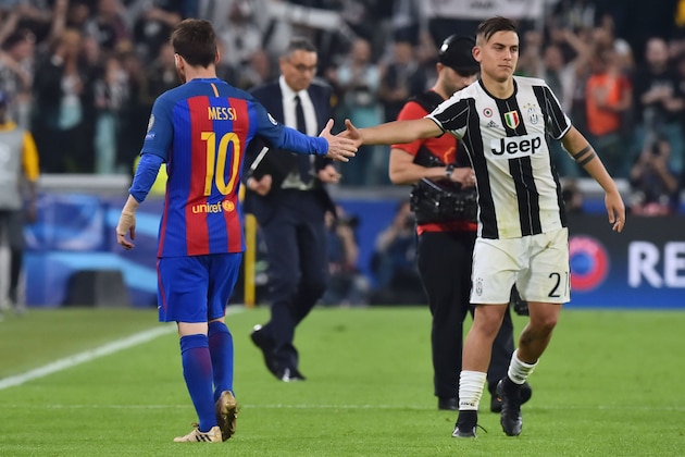 Juventus' forward from Argentina Paulo Dybala (R) shakes hands with Barcelona's Argentinian forward Lionel Messi at the end of the UEFA Champions League quarter final first leg football match Juventus vs Barcelona, on April 11, 2017 at the Juventus stadium in Turin. Juventus won 3-0. / AFP PHOTO / GIUSEPPE CACACE        (Photo credit should read GIUSEPPE CACACE/AFP/Getty Images)
