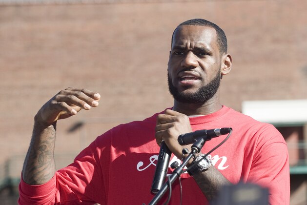 Miami Heat basketball plyaer LeBron James speaks to the crowd before the start of the LeBron James Family Foundation, King for Kids Bike-a-thon, in Akron, Ohio, Saturday, Aug. 7, 2010. James grew up in Akron and played for the Cleveland Cavaliers before signing to play with the Heat as a free agent . (AP Photo/Phil Long)