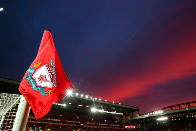 LIVERPOOL, ENGLAND - DECEMBER 11: A general view of a sunset over Anfield, the home stadium of Liverpool with the badge on a corner flag prior to the Premier League match between Liverpool and West Ham United at Anfield on December 11, 2016 in Liverpool, England. (Photo by Robbie Jay Barratt - AMA/Getty Images)
