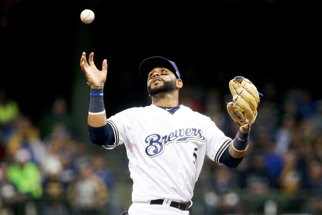 MILWAUKEE, WI - APRIL 03:  Jonathan Villar #5 of the Milwaukee Brewers bobbles the ball while attempting to turn a double play in the seventh inning against the Colorado Rockies of the MLB Opening Day game at Miller Park on April 3, 2017 in Milwaukee, Wisconsin. (Photo by Dylan Buell/Getty Images)