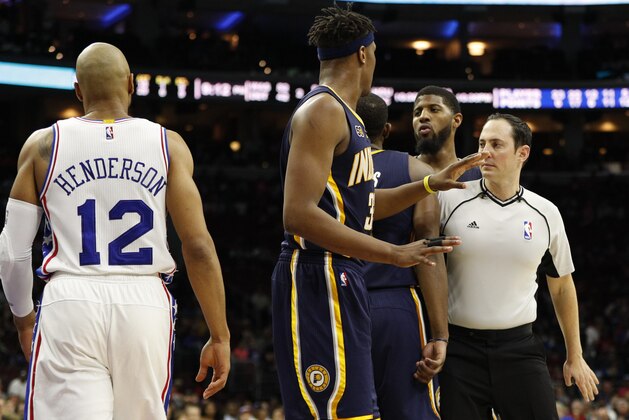 Referee Marat Kogut, right, steps in between Indiana Pacers' Paul George, center right and Philadelphia 76ers' Gerald Henderson, left, after their second altercation, which will lead to both ejections during the second half of an NBA basketball game, Monday, April 10, 2017, in Philadelphia. The Pacers won 120-111. (AP Photo/Chris Szagola)