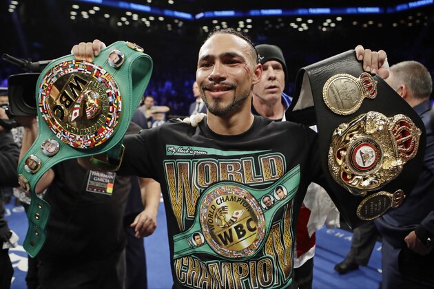 Keith Thurman poses for photographs after a welterweight championship boxing match against Danny Garcia on Saturday, March 4, 2017, in New York. Thurman won the fight. (AP Photo/Frank Franklin II)
