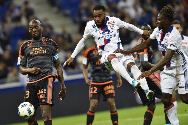Lyon's French forward Alexandre Lacazette (C) kicks the ball during the French L1 football match between Olympique Lyonnais (OL) and Lorient (FCL) on April 8, 2017, at the Parc Olympique Lyonnais stadium in Decines-Charpieu near Lyon, central-eastern France. / AFP PHOTO / ROMAIN LAFABREGUE        (Photo credit should read ROMAIN LAFABREGUE/AFP/Getty Images)