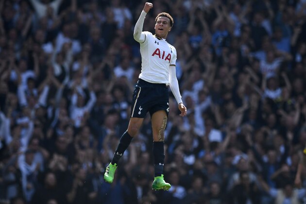 TOPSHOT - Tottenham Hotspur's English midfielder Dele Alli celebrates scoring his team's first goal during the English Premier League football match between Tottenham Hotspur and Watford at White Hart Lane in London, on April 8, 2017. / AFP PHOTO / Justin TALLIS / RESTRICTED TO EDITORIAL USE. No use with unauthorized audio, video, data, fixture lists, club/league logos or 'live' services. Online in-match use limited to 75 images, no video emulation. No use in betting, games or single club/league/player publications.  /         (Photo credit should read JUSTIN TALLIS/AFP/Getty Images)