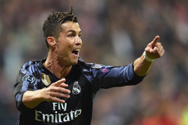 Real Madrid's Portuguese forward Cristiano Ronaldo reacts after scoring during the UEFA Champions League 1st leg quarter-final football match FC Bayern Munich v Real Madrid in Munich, southen Germany on April 12, 2017.
Security was ratcheted up in Munich, one day after three explosions rocked the team bus of German football club Borussia Dortmund minutes after the bus set off to a planned Champions League game against Monaco on Tuesday night (April 11, 2017). / AFP PHOTO / Christof Stache        (Photo credit should read CHRISTOF STACHE/AFP/Getty Images)