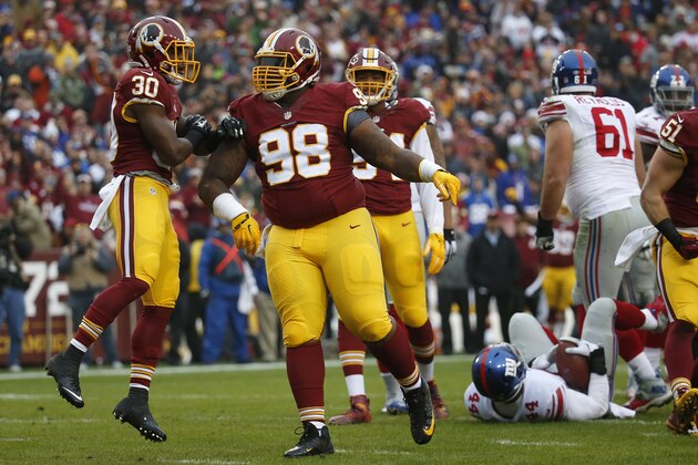 LANDOVER, MD - NOVEMBER 29: Defensive tackle Terrance Knighton #98 of the Washington Redskins and strong safety Kyshoen Jarrett #30 of the Washington Redskins react after a play while running back Andre Williams #44 of the New York Giants lays on the field in the first quarter at FedExField on November 29, 2015 in Landover, Maryland. (Photo by Rob Carr/Getty Images)