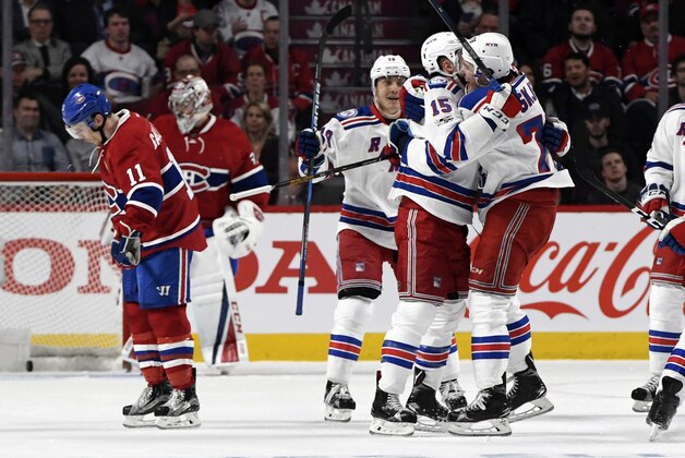 Apr 12, 2017; Montreal, Quebec, CAN; New York Rangers forward Tanner Glass reacts with teammates after scoring a goal against the Montreal Canadiens during the first period of game one of the first round of the 2017 Stanley Cup Playoffs at the Bell Centre. Mandatory Credit: Eric Bolte-USA TODAY Sports