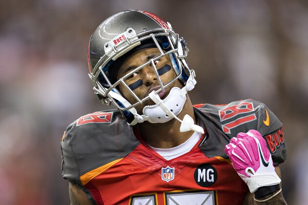 NEW ORLEANS, LA - OCTOBER 5:  Louis Murphy #18 of the Tampa Bay Buccaneers shows the official how he was grabbed during a game against the New Orleans Saints at Mercedes-Benz Superdome on October 5, 2014 in New Orleans, Louisiana.  The Saints defeated the Buccaneers 37-31.  (Photo by Wesley Hitt/Getty Images)