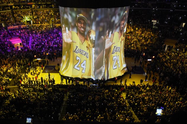 Los Angeles Lakers forward Kobe Bryant image is displayed to the crowd during a ceremony before Bryant's last during the first half of an NBA basketball game, against the Utah Jazz, Wednesday, April 13, 2016, in Los Angeles. (AP Photo/Mark J. Terrill)