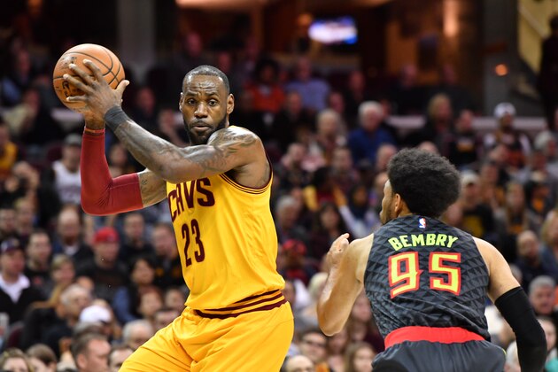 CLEVELAND, OH - APRIL 7: LeBron James #23 of the Cleveland Cavaliers looks for a pass while under pressure from DeAndre' Bembry #95 of the Atlanta Hawks during the first half at Quicken Loans Arena on April 7, 2017 in Cleveland, Ohio. NOTE TO USER: User expressly acknowledges and agrees that, by downloading and/or using this photograph, user is consenting to the terms and conditions of the Getty Images License Agreement. (Photo by Jason Miller/Getty Images)