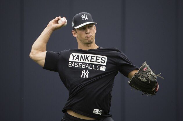 FILE - In this Feb. 14, 2017, file photo, New York Yankees James Kaprielian throws during a spring training baseball workout in Tampa, Fla. Top Yankees pitching prospect James Kaprielian was placed on the minor league disabled list because of pain in his right elbow and will be sent for scans. The Yankees said Thursday, April 6, 2017, that the 23-year-old right-hander, taken with the 16th overall pick in the 2015 amateur draft, will have an MRI and a dye contrast MRI.(AP Photo/Matt Rourke, File)