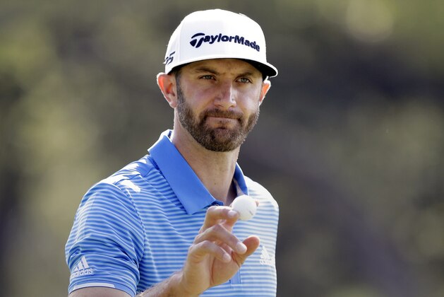 FILE - In this March 26, 2017, file photo, Dustin Johnson waves to the gallery after a birdie putt on the sixth hole during semifinal play at the Dell Technologies Match Play golf tournament at Austin County Club in Austin, Texas. (AP Photo/Eric Gay, File)